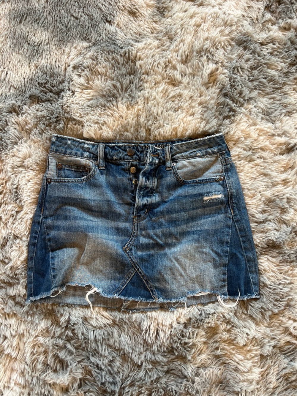 American Eagle Outfitters blue denim mini skirt with distressed hem